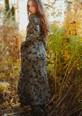 Load image into Gallery viewer, Woman in a long floral dress standing in an autumn forest