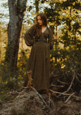 Load image into Gallery viewer, Woman in a long, patterned dress standing in a forest